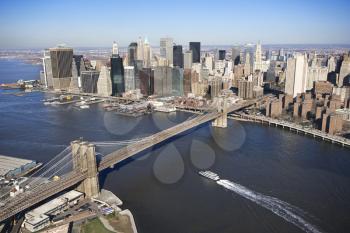 Royalty Free Photo of an Aerial View of New York City With  Brooklyn Bridge, Manhattan Skyline and a Ferry Boat
