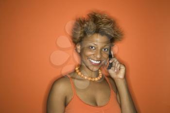 Royalty Free Photo of a Smiling African American Woman Talking on a Cellphone