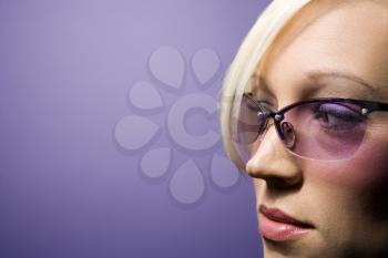 Royalty Free Photo of a Blonde Woman Wearing Sunglasses