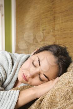 Royalty Free Photo of a Young Woman With Eyes Closed Laying Down