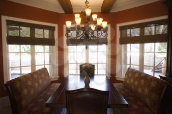 Royalty Free Photo of a Dining Room With Table and Chairs in an Affluent Home