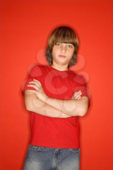 Royalty Free Photo of a Portrait of a Boy With Arms Crossed