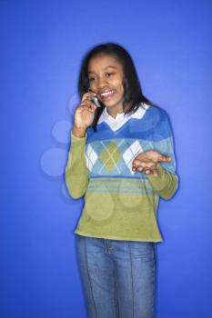 Royalty Free Photo of a Teenage Girl Talking on a Cellphone