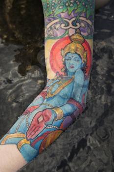Royalty Free Photo of a Womans Tattooed Arm By a Tidal Pool in Maui, Hawaii, USA