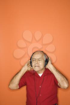 Royalty Free Photo of an Older Man Wearing Headphones