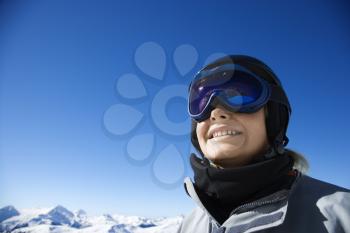 Royalty Free Photo of a Teen Wearing Snowboarding Helmet and Googles