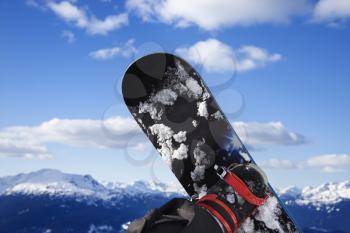 Royalty Free Photo of a Snowboard and Mountain