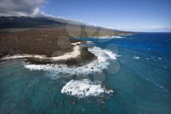 Royalty Free Photo of an Aerial of Pacific Ocean and Maui, Hawaii Coast With Lava Rocks