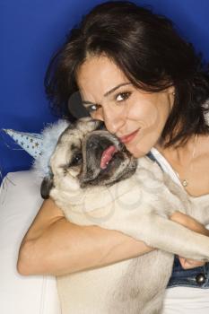 Royalty Free Photo of a Woman Holding a Pug