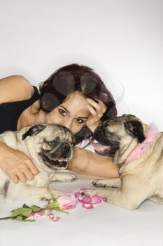 Royalty Free Photo of a Woman With Two Pug Dogs