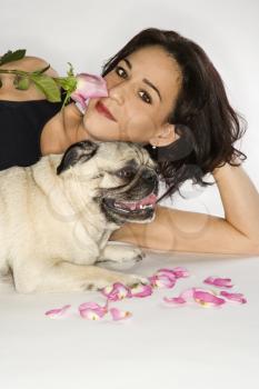 Royalty Free Photo of a Woman Sitting With a Pug 