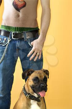 Royalty Free Photo of a Male With a Pet Boxer