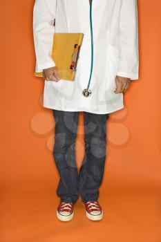 Royalty Free Photo of a Doctor Wearing Jeans and Sneakers