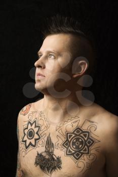 Royalty Free Photo of a Man With Tattoos and a Mohawk 