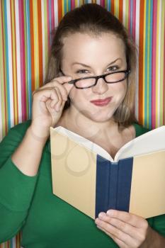 Royalty Free Photo of a Woman Reading a Book
