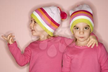 Royalty Free Photo of Twin Girls Standing Together