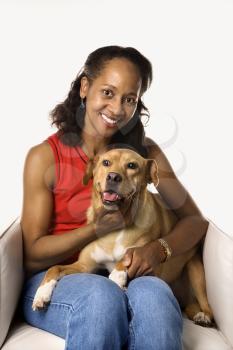 Royalty Free Photo of a Woman Sitting With a Dog in Her Lap