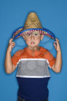 Royalty Free Photo of a Boy Wearing a Sombrero