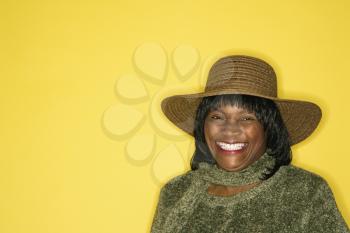 Royalty Free Photo of a Woman Wearing a Hat Smiling