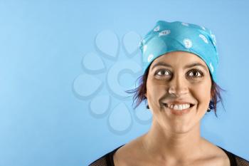 Royalty Free Photo of a Woman Wearing a Bandanna and Smiling