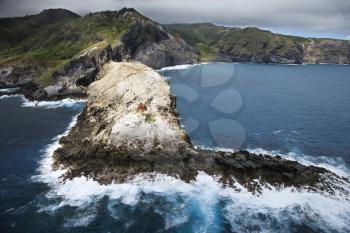 Royalty Free Photo of an Aerial View of Mountains and a Rocky Maui, Hawaii Coastline