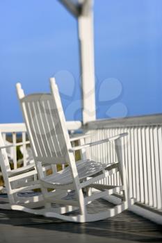 Royalty Free Photo of Rocking Chairs on a Porch on Bald Head Island, North Carolina