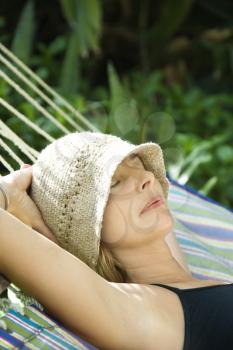 Royalty Free Photo of a Woman Napping in a Hammock