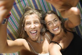 Royalty Free Photo of Women Being Silly in a Hammock