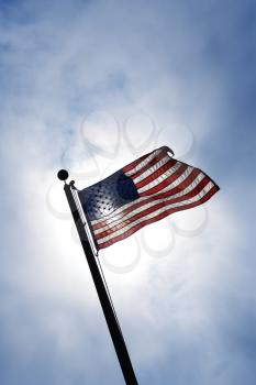 Royalty Free Photo of an American Flag Blowing in a Breeze