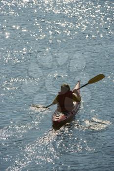 Royalty Free Photo of a Teenage Boy Kayaking on Bald Head Island, North Carolina