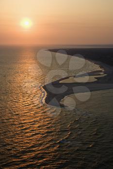 Royalty Free Photo of an Aerial View of the Sun Over the Atlantic Ocean and Shoreline of Bald Head Island, North Carolina