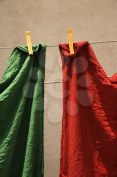 Royalty Free Photo of Red and Green Fabric Hanging on a Clothesline in Lisbon, Portugal