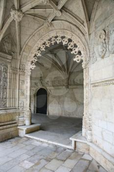 Royalty Free Photo of an Oranate Arched Doorway in Jeronimos Monastery in Lisbon, Portugal