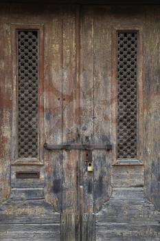 Royalty Free Photo of Exterior Locked Doors With Worn Paint in Lisbon, Portugal