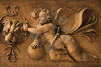 Royalty Free Photo of a Close-up Wood Carving of Cherub Angel in the Vatican Museum, Rome, Italy