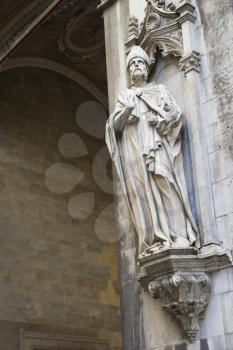 Royalty Free Photo of a Statue on the Side of a Church in Siena