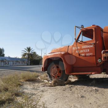 Royalty Free Photo of an Old Fire Truck Abandoned in a Desolate Town