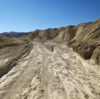 Royalty Free Photo of a Dirt Road Through Death Valley National Park
