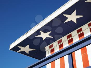 Royalty Free Photo of a Lifeguard Tower Painted Red, White and Blue With Stars and Stripes on a Beach in Miami, Florida, USA