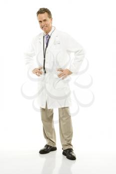 Royalty Free Photo of a Doctor With His Hands on His Hips Smiling