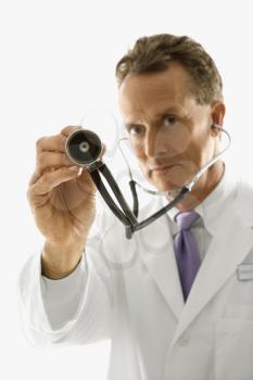 Royalty Free Photo of a Male Doctor Holding Out a Stethoscope