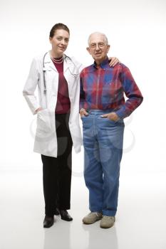 Royalty Free Photo of a Female Doctor With Her Arm Around an Elderly Man's Shoulder 