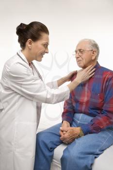 Royalty Free Photo of a Female Doctor Checking an Elderly Man's Pulse