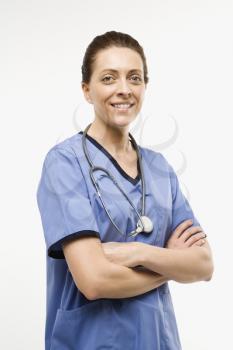 Royalty Free Photo of a Portrait of a Smiling Female Doctor Standing Against a White Background