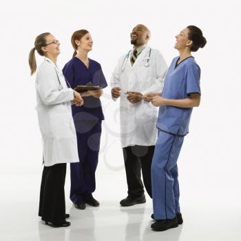 Royalty Free Photo of Medical Healthcare Workers Standing Together Laughing