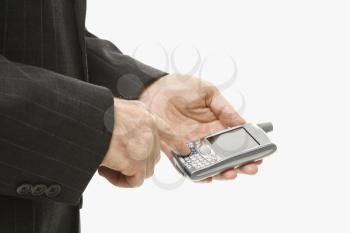 Royalty Free Photo of a Businessman Using a PDA