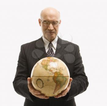 Royalty Free Photo of a Businessman Holding a Globe
