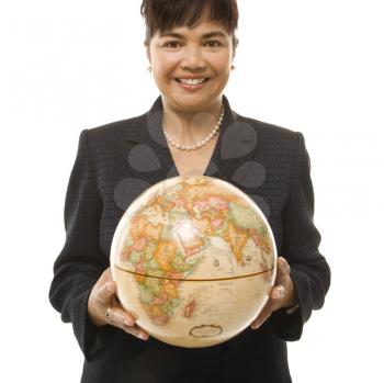 Royalty Free Photo of a Businesswoman Holding a Globe in Both Hands 