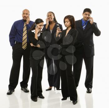 Royalty Free Photo of a Group of Businesspeople Standing Talking on Their Cellphones