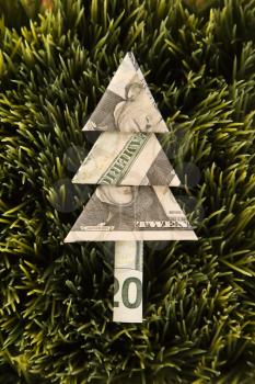 Royalty Free Photo of an Origami Tree Made From a Twenty Dollar Bill Placed in Grass